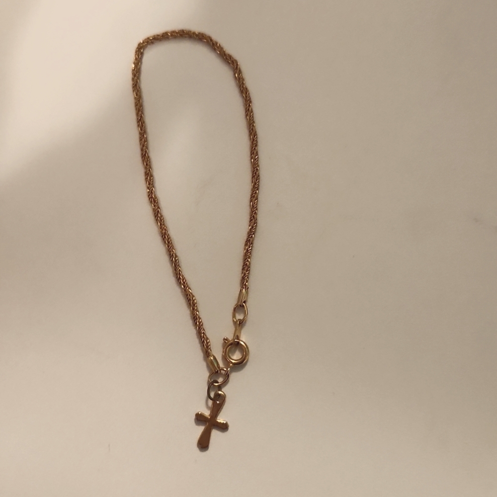 Gold bracelet with cross